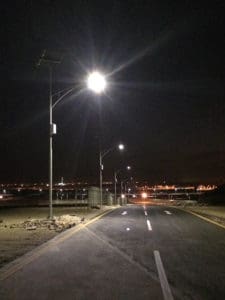 brightest solar led street lights illuminating a road at night.
