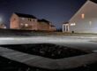 The image portrays a solar lighting solution for a mailbox area in a residential area