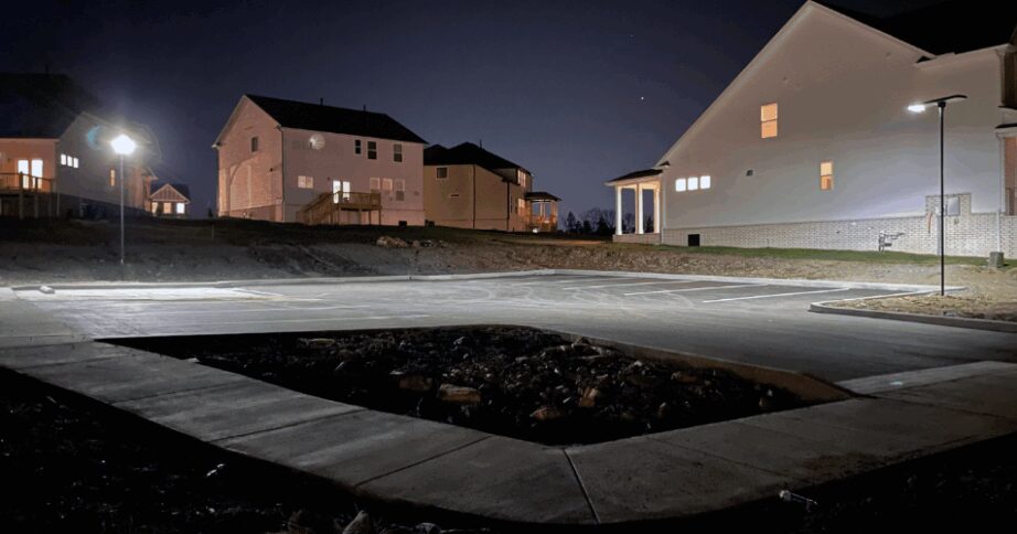The image portrays a solar lighting solution for a mailbox area in a residential area